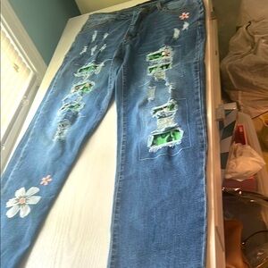 Medium-Wash Blue Straight Leg Jeans with Unique Distressing